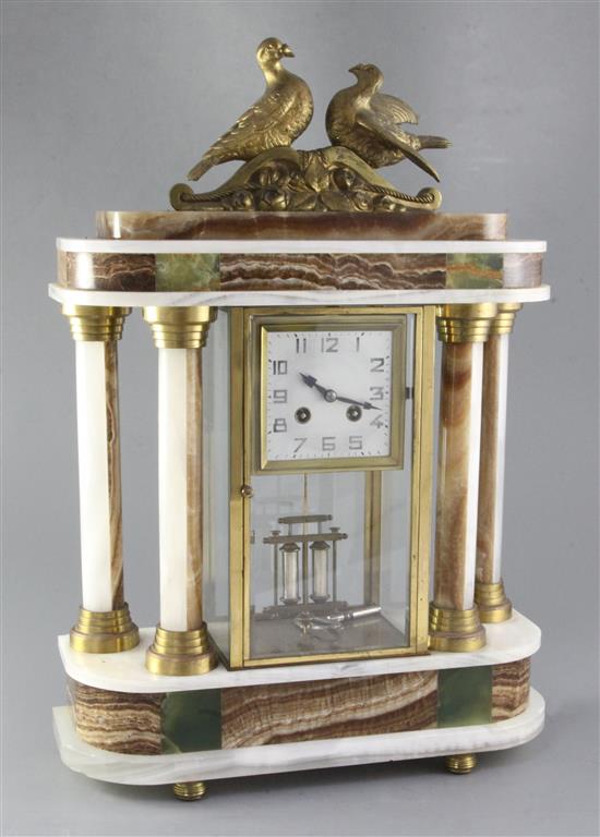 A 1930s polychrome onyx portico mantel clock, height 53cm